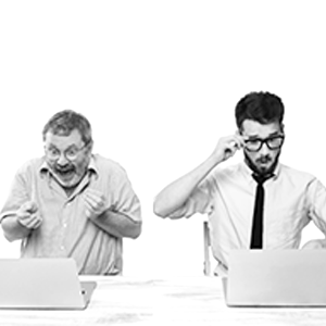 Two men getting excited by looking their laptops